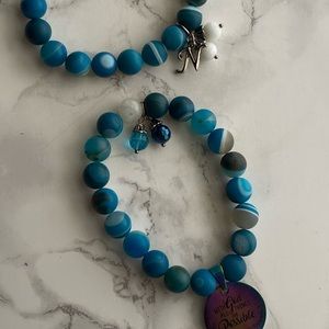 Two piece  Beaded Bracelet Set (stretchy) . With two charms .